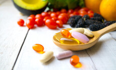 Pills,And,Capsules,In,Wooden,Spoon,With,Fresh,Fruits.multivitamins,And