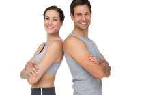 Portrait,Of,A,Happy,Fit,Young,Couple,With,Hands,Crossed