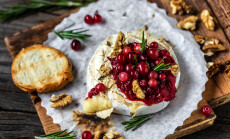 Baked,Camembert,With,Cranberry,Sauce,,Baguette,Bread,And,Rosemary,On