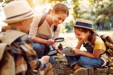 Happy,Family:,Two,Kids,Boy,And,Girl,With,Backpacks,Looking