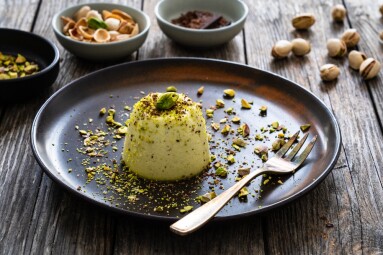 Panna,Cotta,With,Pistachios,On,Wooden,Table