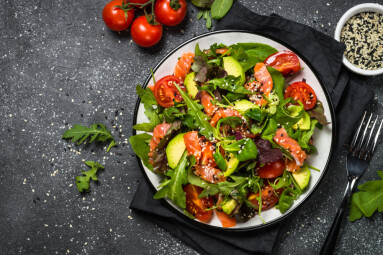 Salmon,Salad,With,Green,Leaves,,Avocado,And,Tomato,On,Black