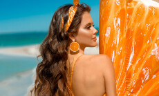 Beautiful,Hippie,Girl,Portrait,With,Orange,Earring,By,Inflatable,Pool