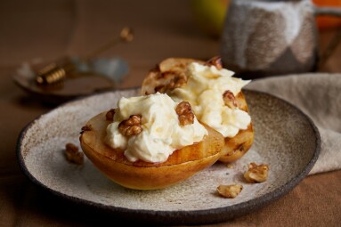 Side,View,Of,Sweet,Grilled,Pears,With,Cream,And,Nuts.