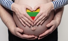 Lithuanian,Family,Concept.,Man,Embracing,Pregnant,Woman,Belly,And,Heart