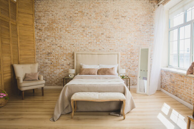 Beautiful,Loft,Bedroom,With,Bed,Near,Brick,Wall