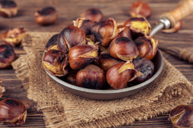 Chestnuts,In,A,Pan,On,A,Wooden,Background