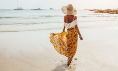 Girl,Wearing,Floral,Maxi,Skirt,Walking,Barefoot,On,The,Sea