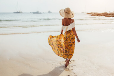 Girl,Wearing,Floral,Maxi,Skirt,Walking,Barefoot,On,The,Sea