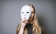 Teen,Girl,Hiding,Her,Face,Behind,Mask,-,Identity,Or