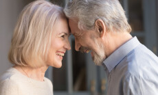 Portrait,Of,Happy,Elderly,Husband,And,Wife,Touch,Foreheads,Look
