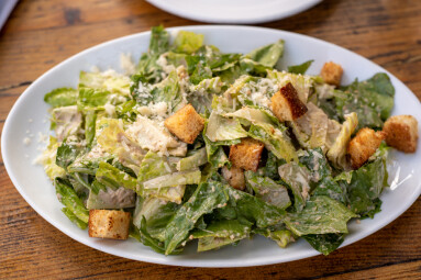 Lettuce,And,Croutons,Topped,With,Shredded,Cheese,,Cezar,Salad,On