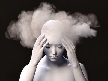 Brain,Fog.,A,Female,Figure,With,Her,Hands,Clasped,At