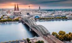 Cologne,Aerial,View,With,Trains,Move,On,A,Bridge,Over