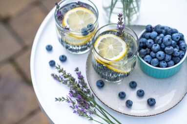 Two,Glasses,With,Homemade,Lemonade,Made,Of,Fresh,Blueberries,,Lemon