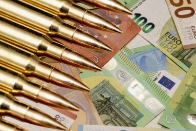 Yellow,Cartridges,And,Shell,Casings,On,Euro,Banknotes.,Concept:,War