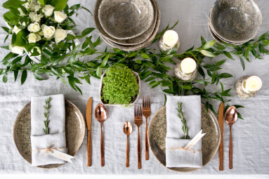 Holiday,Table,Setting,With,Linen,Napkins,And,Rose,Gold,Cutlery.