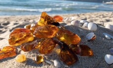 Shiny,Transparent,Orange,Baltic,Amber,Stones,On,A,Sand.,Old