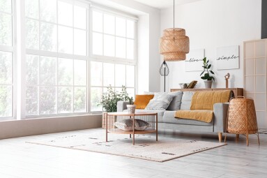 Interior,Of,Light,Living,Room,With,Cozy,Grey,Sofa,And