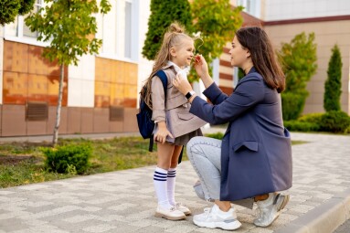 Mom,Accompanies,Her,First-grader,Daughter,To,School,,Kissing,Her,And