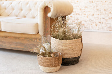 Wicker,Baskets,With,Dried,Flowersnear,The,Sofa,On,Floor.,Living