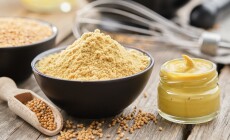 Mustard,Sauce,Jar,And,Bowl,Of,Powdered,Mustard,Seeds.,Scoop