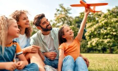 Happy,Young,Family,Dad,,Mom,And,Two,Children,Daughters,Playing