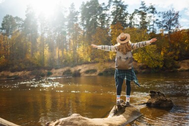 Beautiful,Woman,Traveler,Enjoying,Autumn,Hiking,Along,The,River.,A