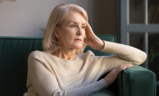 Pensive,Thoughtful,Middle,Aged,Lady,Looking,Away,Sit,Alone,At