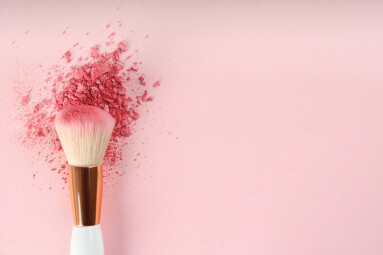 Makeup,Brush,And,Scattered,Blush,On,Pink,Background,,Top,View.