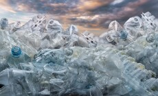 Plastic,Problem,,A,Mountain,Of,Plastic,Bottles,Against,The,Sky.