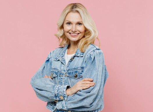 Elderly,Smiling,Happy,Confident,Woman,50s,Wearing,Denim,Jacket,Hold