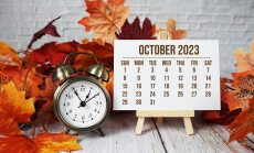 October,2023,Monthly,Calendar,Maple,Leaf,Decoration,On,Wooden,Background