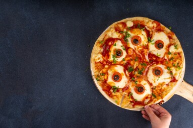 Funny,Creepy,Halloween,Pizza,With,Eyes,Made,From,Cheese,,Tomatoes