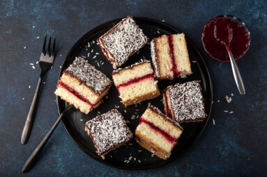 Australian,Lamington,Cake,With,Raspberry,Jam,,Top,View,,Dark,Blue