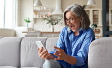 Amazed,Happy,Mature,Older,60s,Woman,,Excited,Customer,Holding,Smartphone