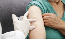 Senior,Woman,Receiving,Vaccine.,Medical,Worker,Vaccinating,An,Elderly,Patient