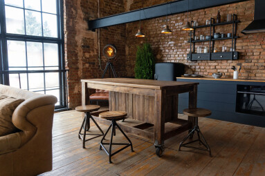 Side,View,On,A,Wooden,Table,And,Spacious,Industrial,Loft