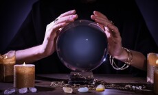 Soothsayer,Using,Crystal,Ball,To,Predict,Future,At,Table,In