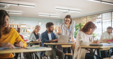 Young,Teacher,Checking,Up,On,An,Indian,Man,With,Laptop