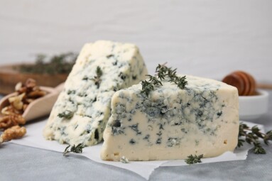 Tasty,Blue,Cheese,With,Thyme,On,Grey,Table,,Closeup