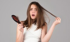 Hair,Loss,Woman,With,A,Comb,And,Problem,Hair.,Hairloss