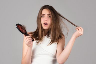 Hair,Loss,Woman,With,A,Comb,And,Problem,Hair.,Hairloss