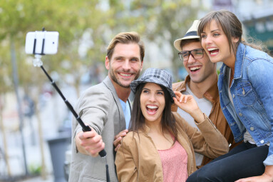 Group,Of,Friends,Taking,Picture,Of,Themselves,With,Smartphone