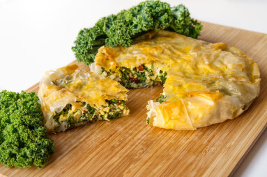 Kale,And,Egg,Pie,With,Filo,Pastry,On,A,Wooden