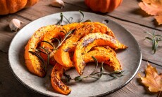 Roasted,Pumpkin,Slices,With,Garlic,And,Herbs,Close,Up.,Oven