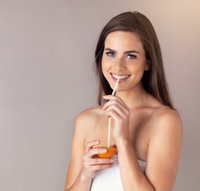 Woman,,Portrait,And,Drinking,Orange,Fruit,In,Studio,,Juice,And