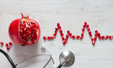 Fruit,Pomegranate,,Stethoscope,And,Ecg,Cardiogram,From,Pomegranate,Seeds,,Healthy