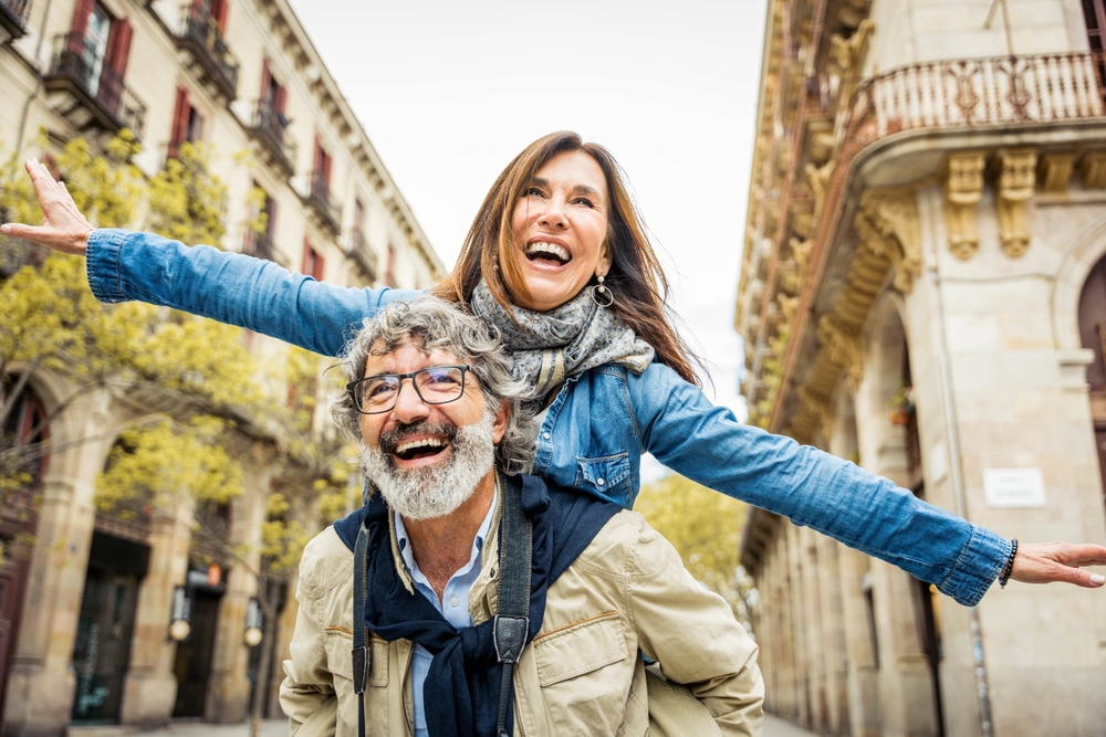 Happy,Senior,Couple,Having,Fun,Walking,On,City,Street,-