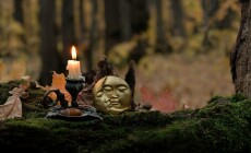 Moon,Amulet,And,Burning,Candle,In,Forest,,Dark,Nature,Background.